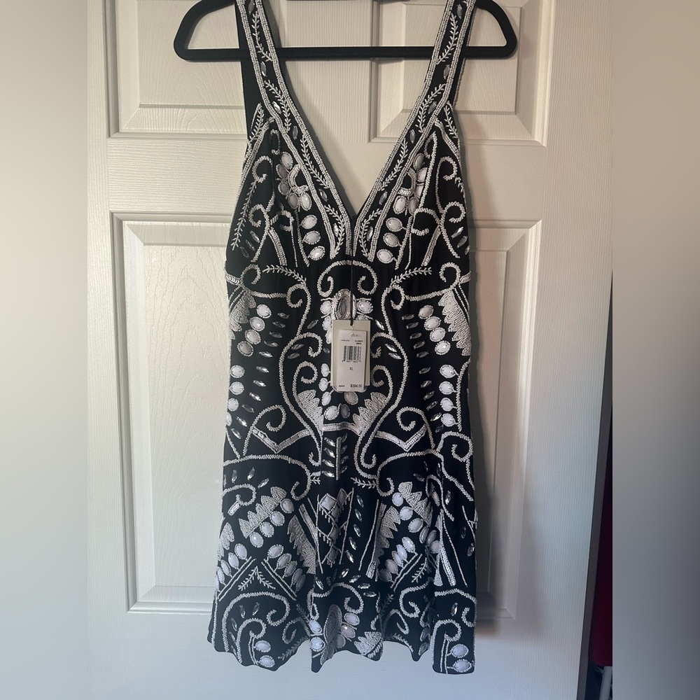 Stunning Alexis embroidered mini-dress.